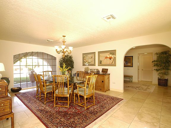 Formal dining room overlooks front and rear gardens
