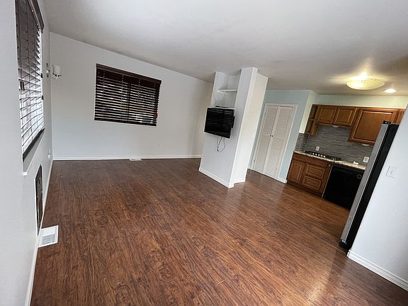 View of the living room and kitchen areas.