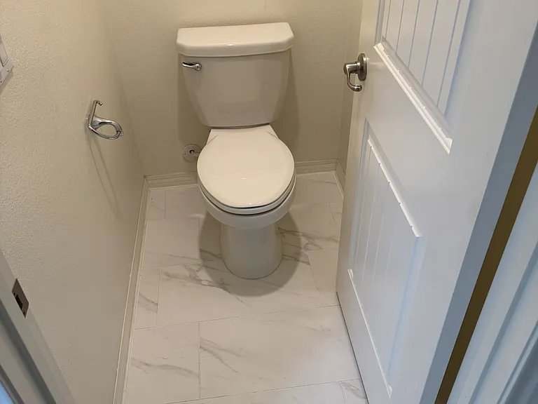 Upstairs main bedroom separate water closet.

New upgraded tile.