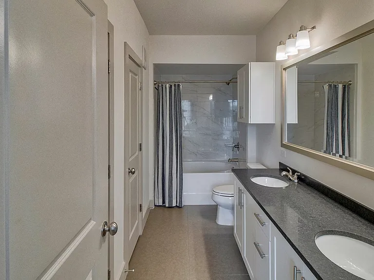 Dual vanities with contemporary lighting