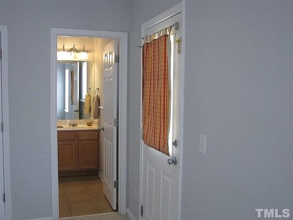 Downstairs bedroom with en suite full bath and patio access.