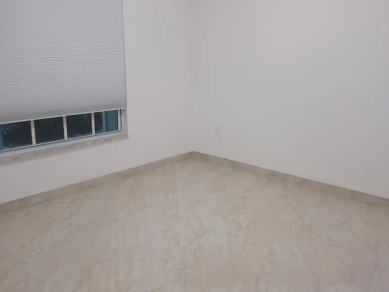 Larger Bedroom with walk in closet