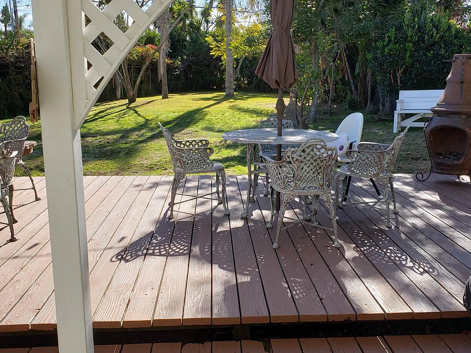 Front yard with huge deck for entertaining