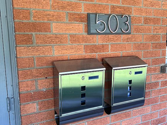 Mailbox for each unit located on the front of the property right by the garage.