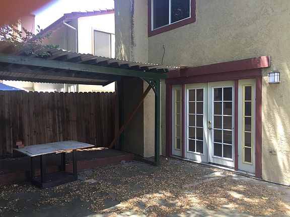 Enclosed back yard with patio doors.
