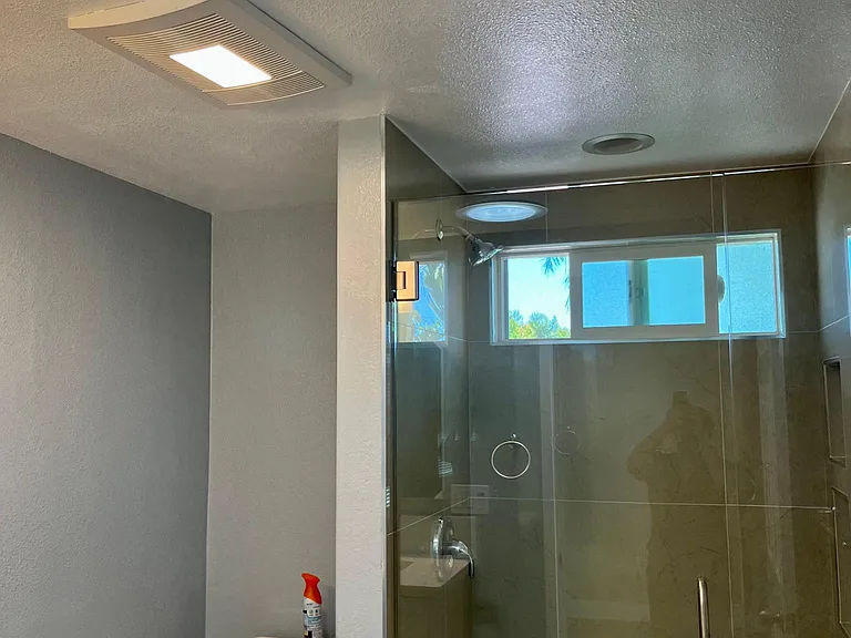 Modern, roomy bathroom with solar tube, heating went, big shower