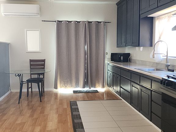 New energy efficient Sliding glass door leads to attached deck and private yard Dog not included :)