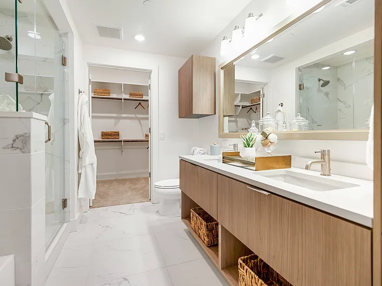 Spa-Inspired Bathrooms with Dual Vanity Countertops, Walk-In Showers and Linen Closets