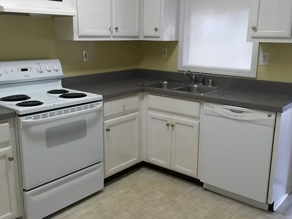Kitchen with cabinets and pantry.