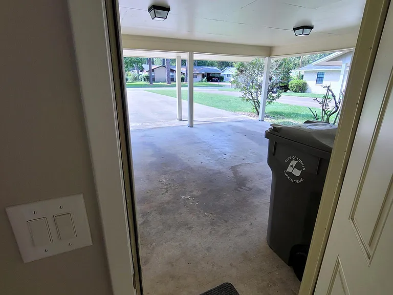 View from entrance from carport into private laundry room.