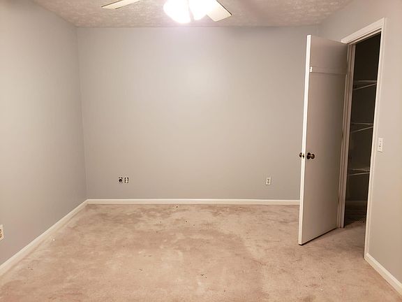 Master bedroom with closet door showing