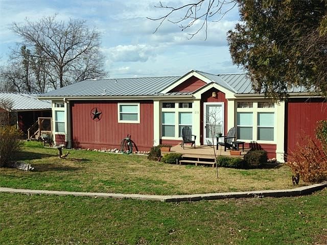 Front exterior, front porch, metal roof, gutters