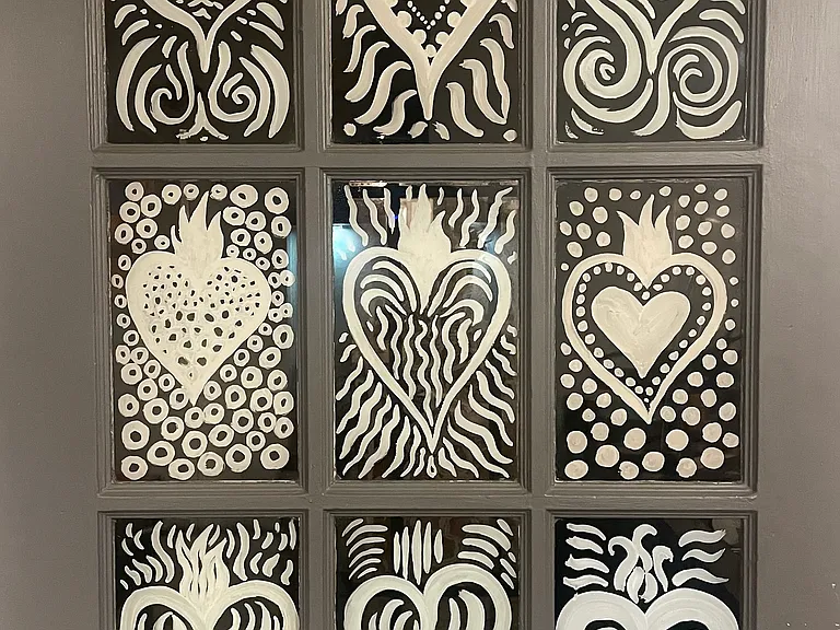 Hand painted door leading from kitchen to laundry room of main house