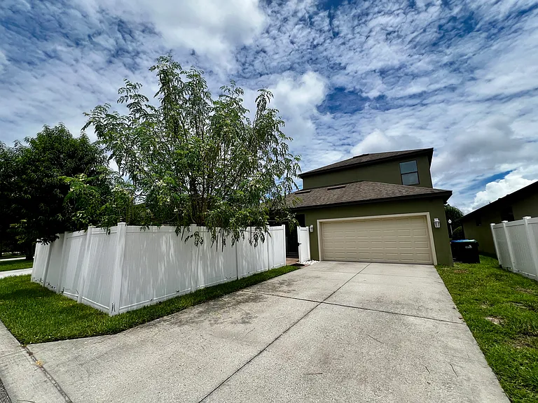 SPACIOUS DRIVEWAY AND PRIVACY FENCE!