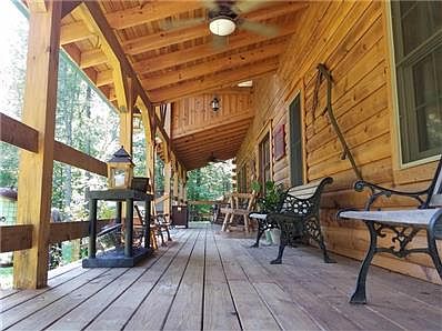 Enjoy Sunday morning coffee while bird or deer watching on this extraordinary front porch.