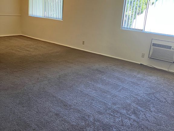 Very large living room with L shaped dining room