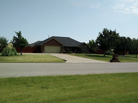 Front Yard
						:
						Wide view of the front of the house with large front yard