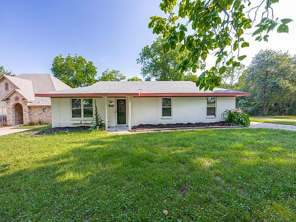 Adorable home on this huge lot! Driveway around back to the 2 car garage