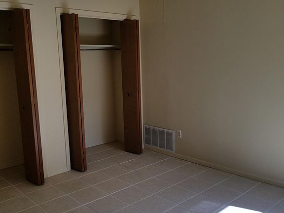 Front bedroom with two separate closets with folden doors.