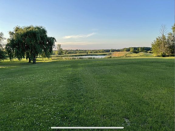 Very large backyard space with pond in back