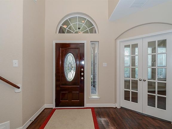 The home was renovated and has freshly painted walls and trim. Pretty leaded front door with transom and side lights.