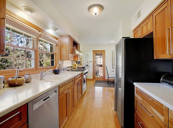 Very efficient and roomy galley kitchen. Viking range & hood and Bosch dishwasher.