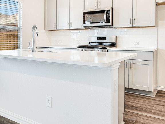 Cook delicious meals in the gourmet kitchen.