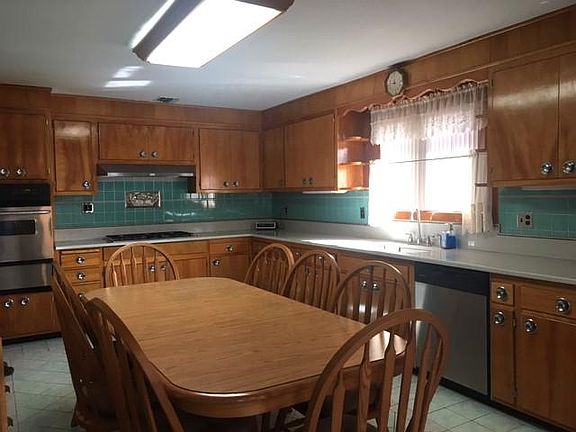 Wall Oven, Cooktop, D/W, Refrigerator, and basement has 2nd refrigerator & freezer