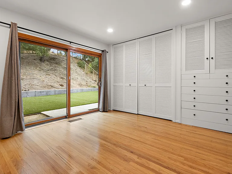 Bedroom 2. Closet and built in cabinetry.