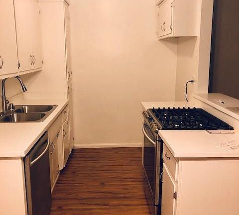 new quartz counters, new stainless steel range, new stainless steel dishwasher