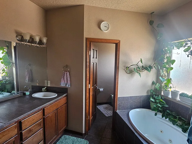 Sink and toilet in a dedicated toilet room.