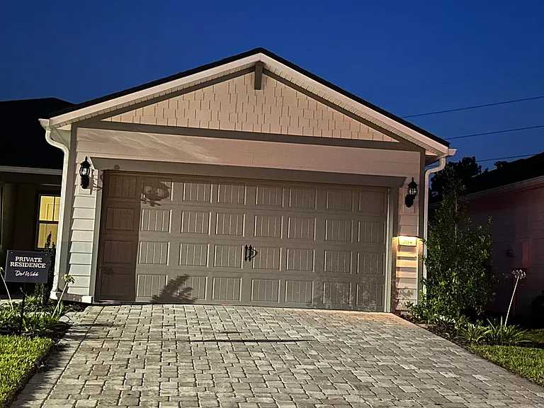 Paver driveway 2 car garage. Electric car charger