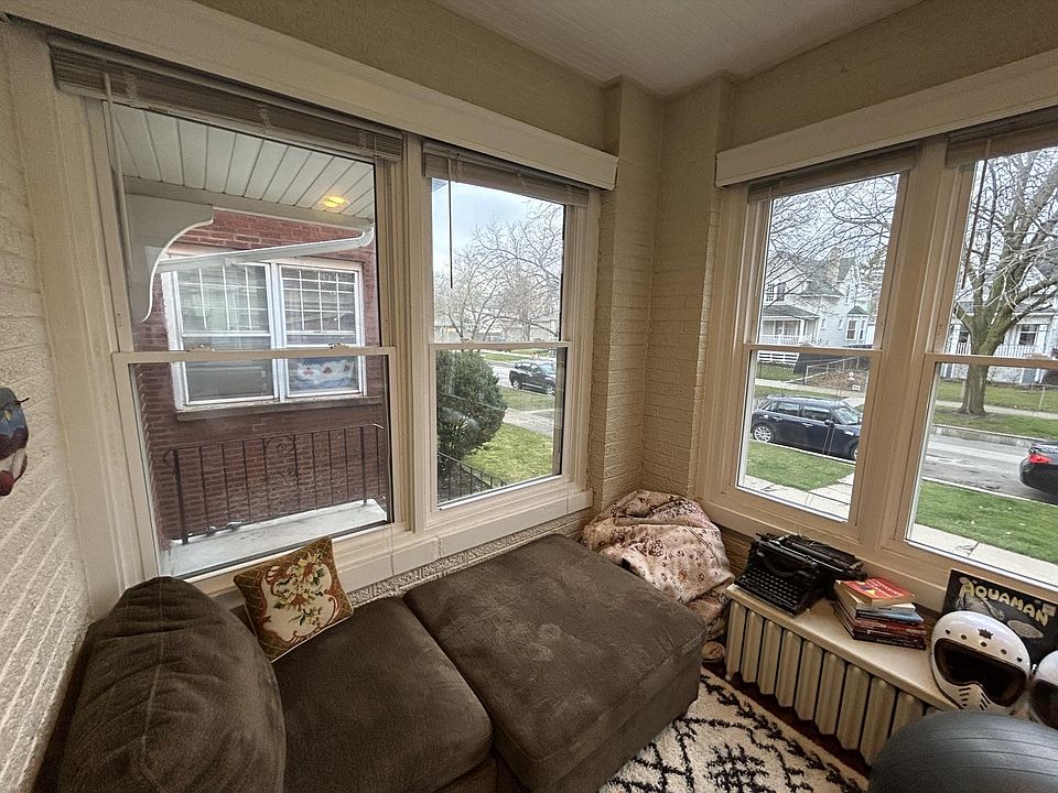 View of ample available street parking through the front sunroom windows. Quiet street with no bumper-to-bumper, paint-scraping parking here.