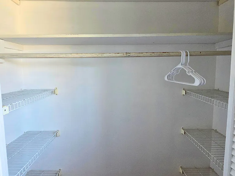 Spacious open closet with hangers for your belongings