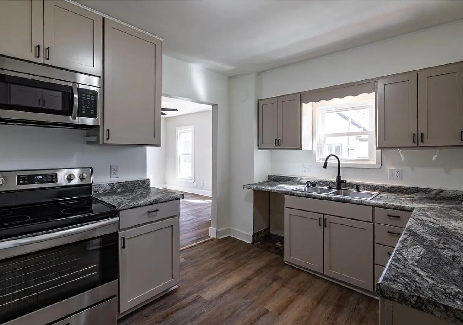 Rare Find! 4BR Home with TWO Detached Garages in Sparta!! — Photo 4