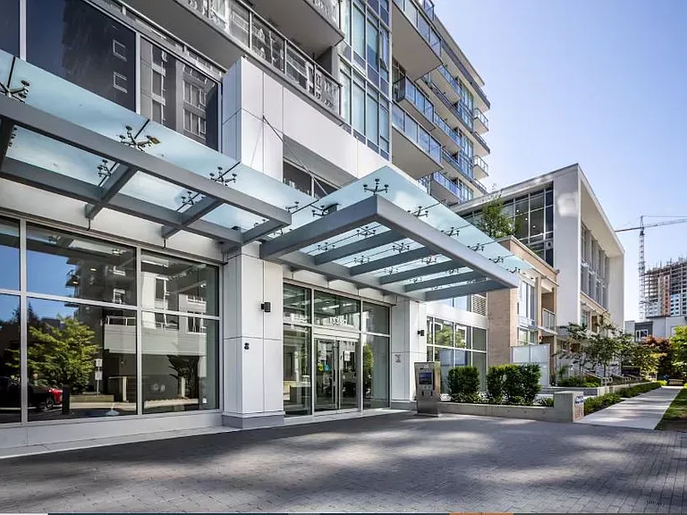 The condominium entrance, along with its clean and well-maintained surroundings, offers a welcoming and tidy atmosphere.