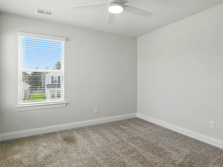 Bedroom 3 - Third bedroom with flexible use as a guest room, office, or children's room. Neutral finishes and closet space, connected via Jack & Jill bath.
