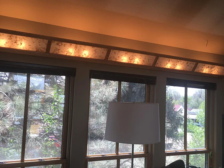 Locally Hand made light valance with paper diffuser and dimmer.