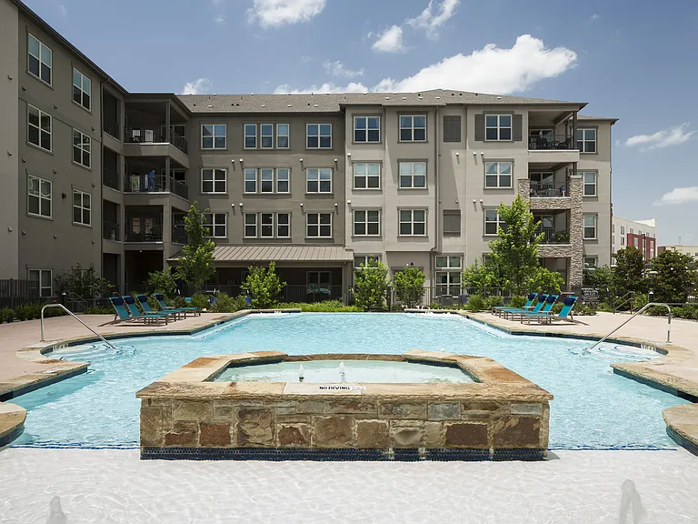 A calming waterfall adds a touch of elegance to our pool.