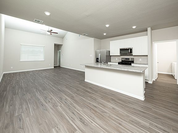 Kitchen and Dining Area to Family Room