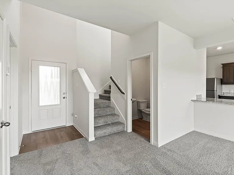 The downstairs powder room is located right off of the family room for convenient access.