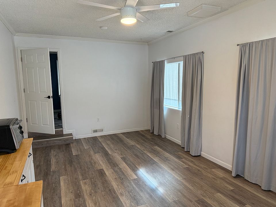 Living area with door to bedroom