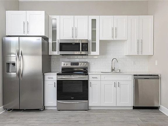 Full kitchen with SS appliances, microwave and dishwasher.