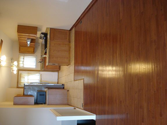 beautiful hardwood Great room and dining area/Tiled kit