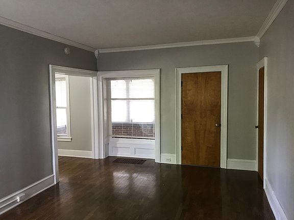 Living room with view of porch and front door