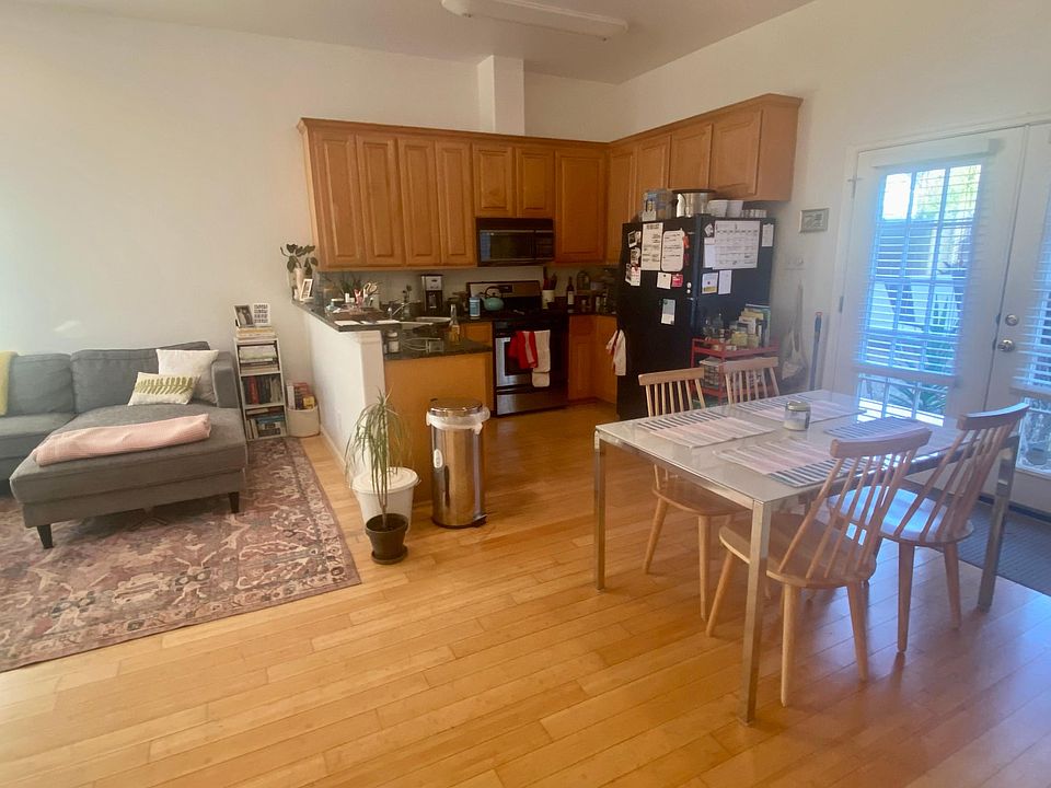 Open concept kitchen, living room & space for dining table, more light from patio doors. High ceilings make the space feel huge!