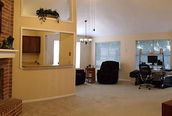 NATURALLY LIGHT AND BRIGHT, SOARING CEILINGS, A WOODBURNING FIREPLACE AND BREAKFAST BAR