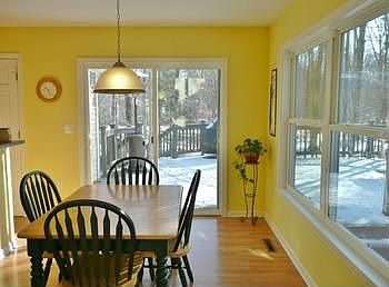 ...or have a seat for a nice family dinner in this wonderful dining area with sliding doors leading out to the large deck! 