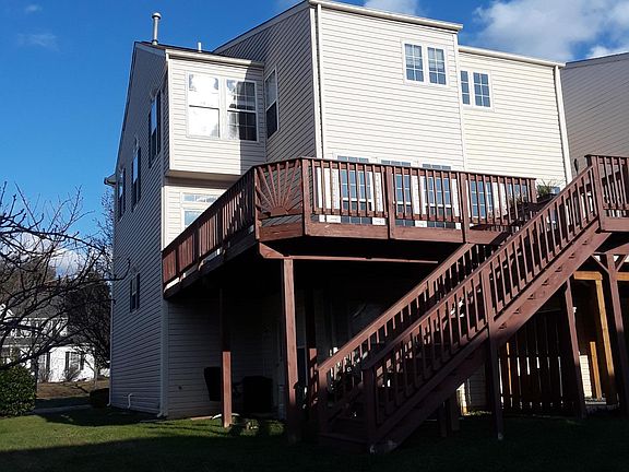 Walk out deck from kitchen leading to side yard