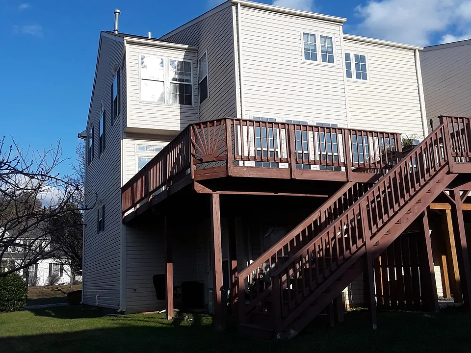 Walk out deck from kitchen leading to side yard